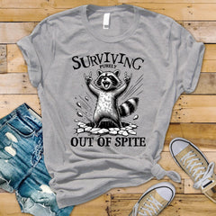 Funny Raccoon T-Shirt: Surviving Purely Out of Spite - Softstyle Tee - Fast UK Tracked Postage